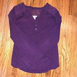 A maroon long sleeve knit shirt